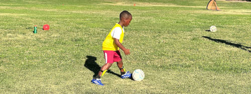 one child plays soccer